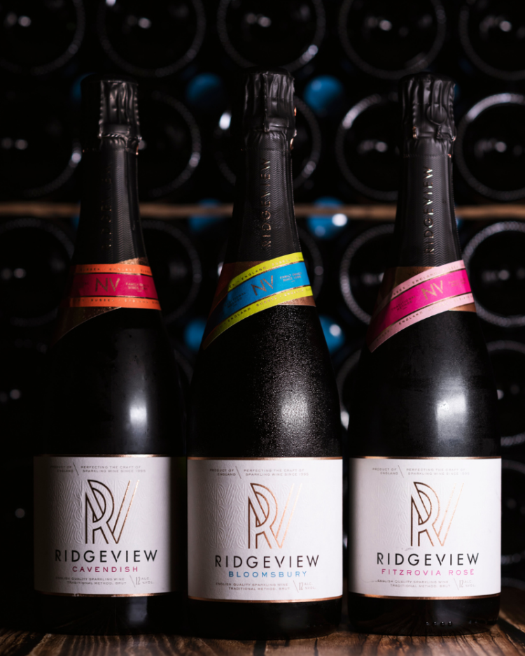 Ridgeview Wine Estate, English Sparkling Wine, 3 Bottles in front of racked bottles behind