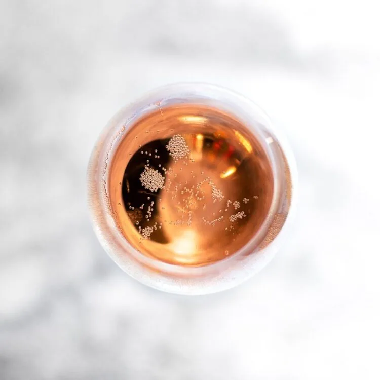 A birds eye view of Fitzrovia Rosé, English Sparkling Wine in a glass with bubbles