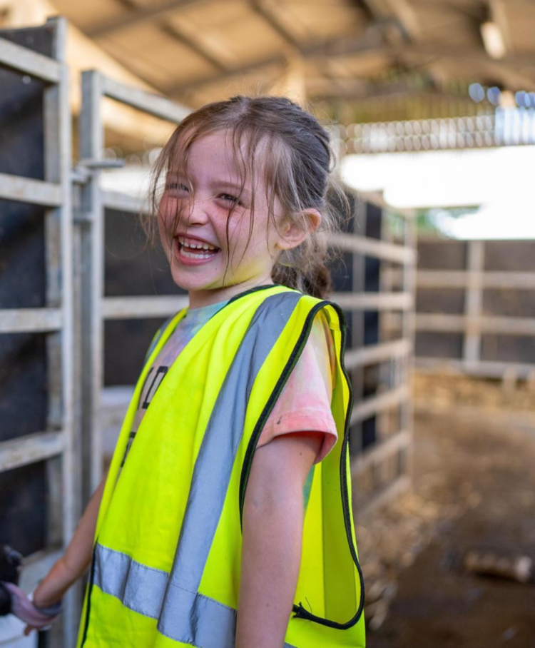 A child in a farm laughing